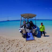 Beach buggy transferring passengers to the beach