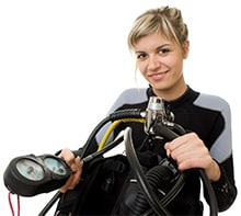 Femaile Scuba Diver Checking dive gauge Femaile Scuba Diver Checking dive gauge.