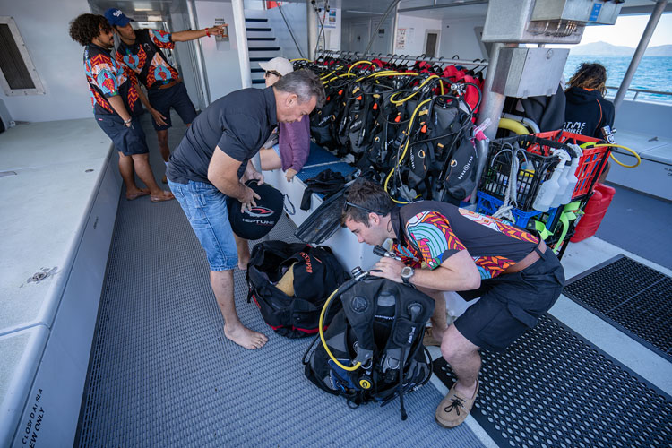 Scuba Divers Preparing Dive Gear