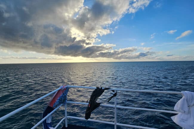 Sunrise over the Great Barrier Reef viewed from the deck of OceanQuest liveaboard.