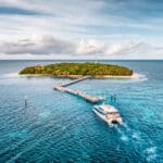 Aerial view of Green Island with the Great Adventures catamaran arriving at the jetty on the Great Barrier Reef.