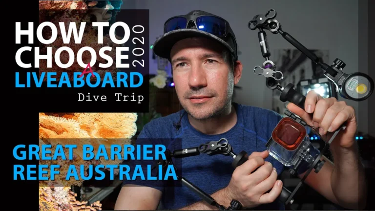 Clint from Cairns Dive Adventures explaining how to choose a liveaboard dive trip on the Great Barrier Reef while holding underwater camera gear