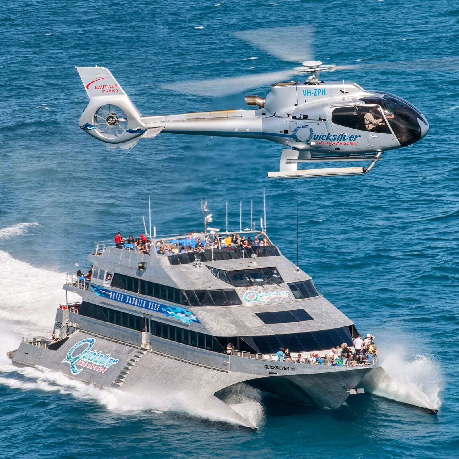 Quicksilver Outer Reef Cruise catamaran with scenic helicopter flight over the Great Barrier Reef departing Port Douglas
