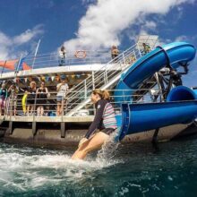 Lady enjoying the water-slide at Moore Reef.